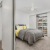 a bedroom with a bed and shelves