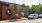 a brick building with a mural on it