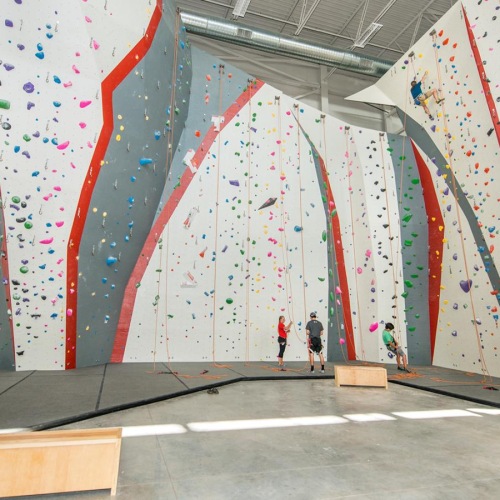 A beautiful community at the heart of all your passions a large indoor rock climbing wall