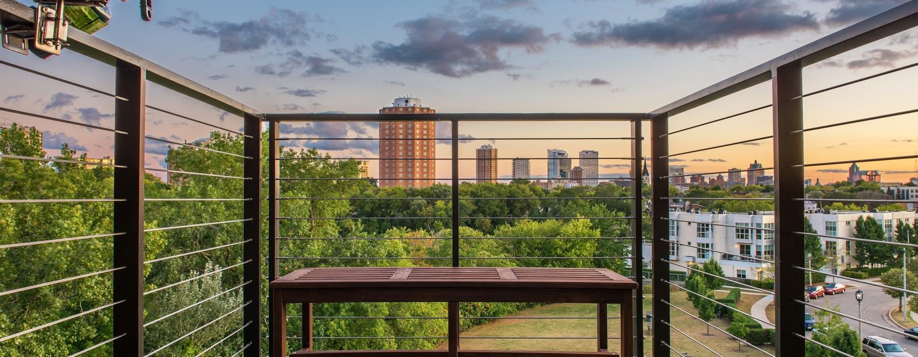 a balcony overlooking a city