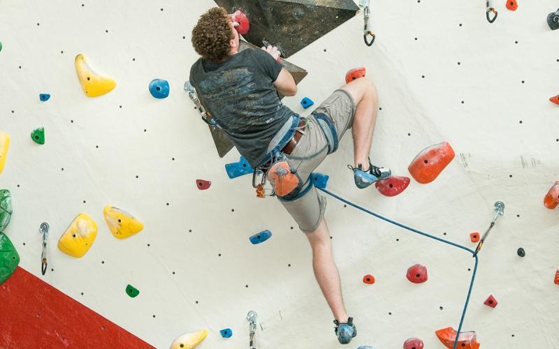 a person on a rock climbing wall